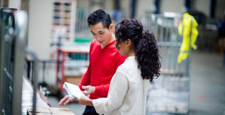 colleagues sorting through mail
