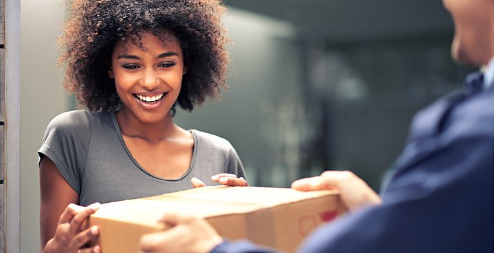 Happy woman receiving parcel