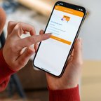 Person tracking a package on the PostNL App