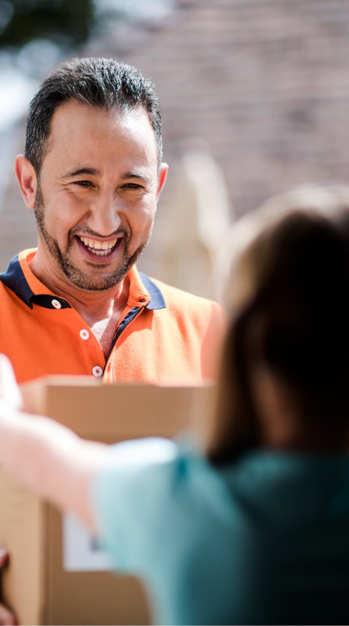 PostNL Belgium employee delivering a package to an excited child