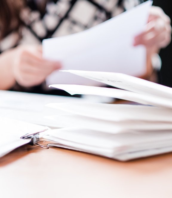 Woman sorting through mail at a table